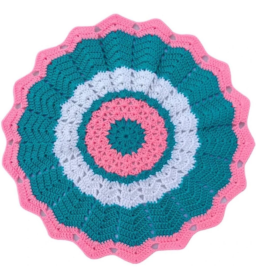Crochet round doily in pink and green